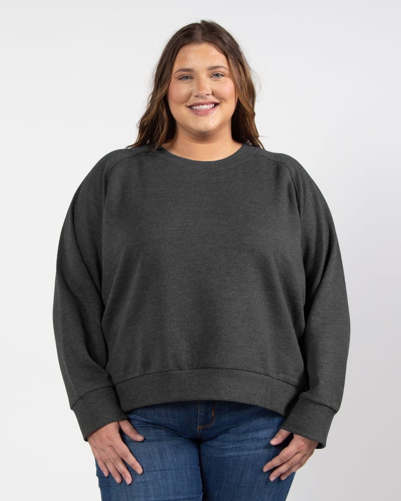 Front of a model wearing a size 1X Boxy Raglan Pullover in Black by chicka-d. | dia_product_style_image_id:289532